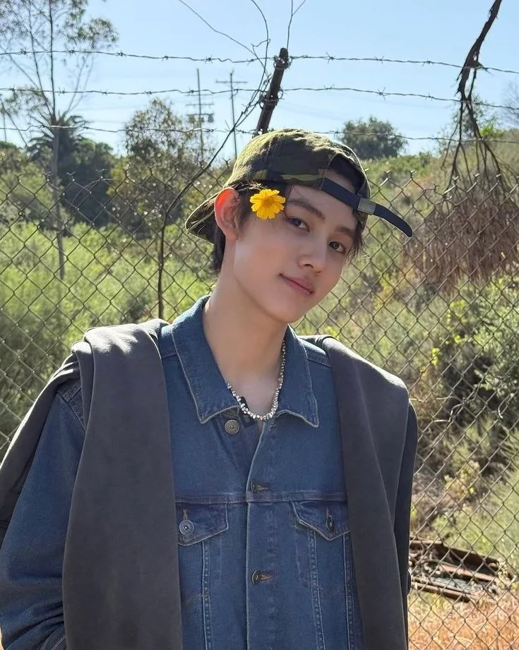 A portrait with a yellow flower